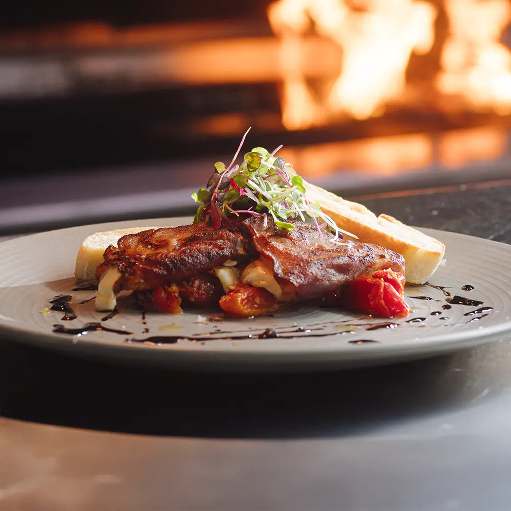 Plated meal in front of flame